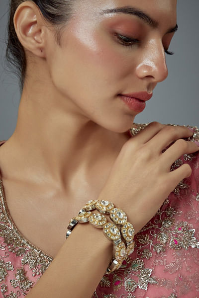 Silver and gold kundan embellished bangles