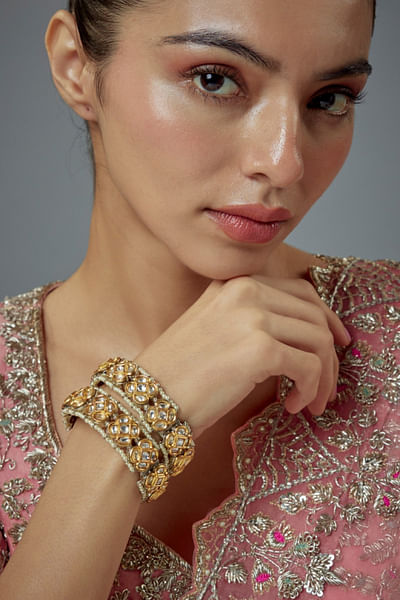Gold and white kundan pearl bangles