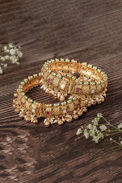 Gold dangler embellished bangles