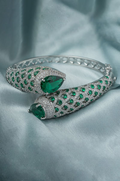Silver and green gemstone-crystal kada