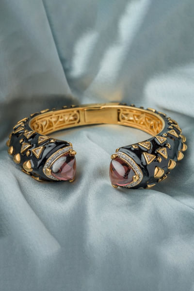 Gold and red gemstone-enamel cuff kada