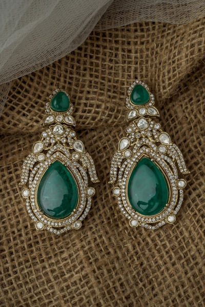 Gold and green stone studded earrings