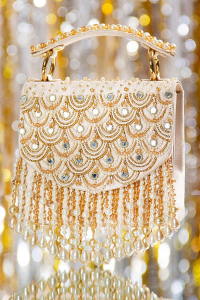 Gold and ivory scalloped clutch