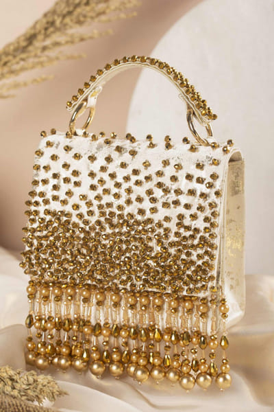 Ivory and gold embellished clutch