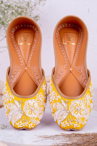 Yellow embroidered juttis