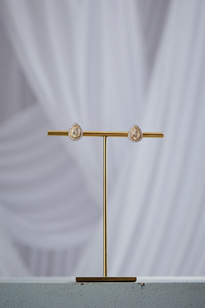 White and gold moissanite stone stud earrings