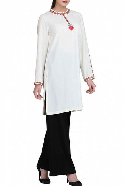 Ivory tunic with black trousers