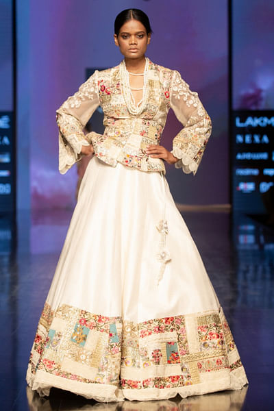 Ivory embroidered peplum and lehenga set