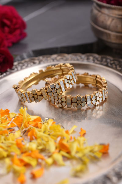 White mother of pearl studded bangles