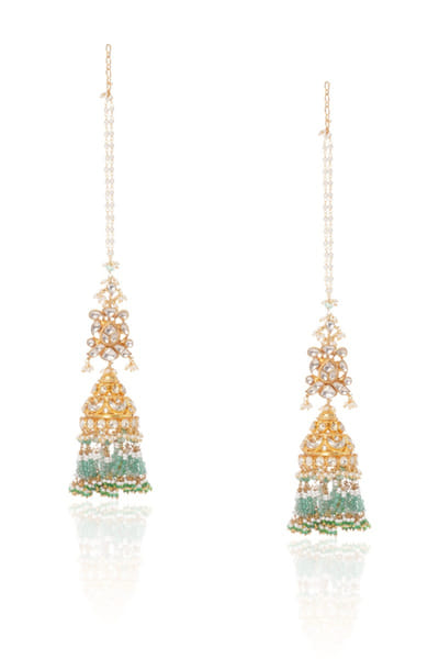 Green and white kundan embellished jhumkas