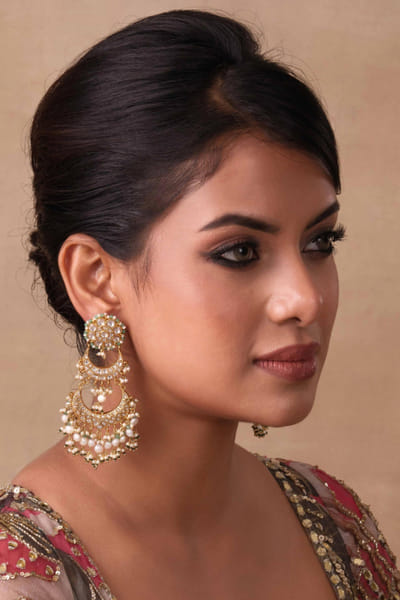 Gold and green kundan encrusted earrings