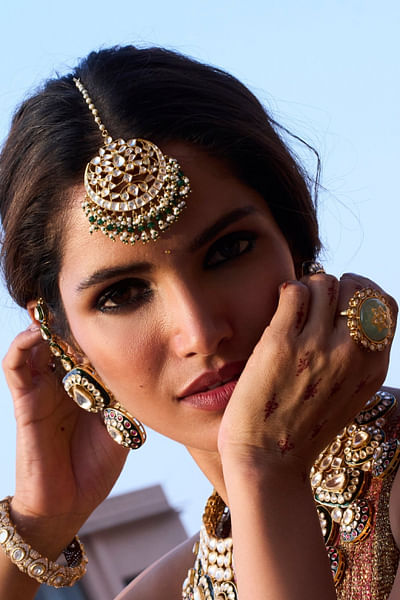 Green and gold kundan maang tikka