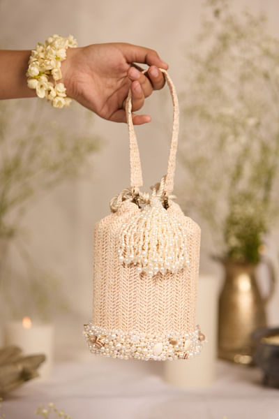 Off-white pearl-shell embellished bucket bag