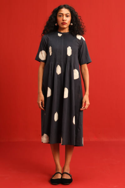 Black and white pleated polka dot dress