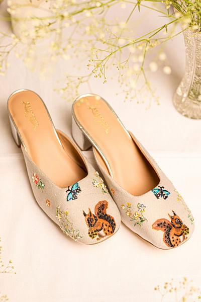 Grey squirrel-butterfly embellished mule heels
